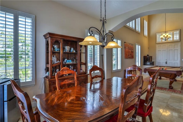 1412 San Clemente Cir, Corona, CA 92882 - dining area featuring arched walkways, an inviting chandelier, billiards, and a wealth of natural light