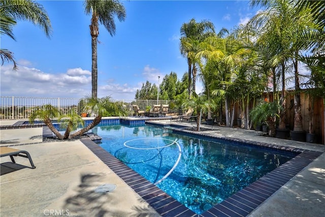1412 San Clemente Cir, Corona, CA 92882 - view of swimming pool featuring a fenced backyard, a fenced in pool, and a patio
