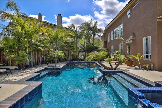 1412 San Clemente Cir, Corona, CA 92882 - view of pool featuring a patio, a pool with connected hot tub, and a fenced backyard