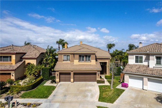 1412 San Clemente Cir, Corona, CA 92882 - mediterranean / spanish home featuring a front yard, stucco siding, concrete driveway, an attached garage, and a tile roof