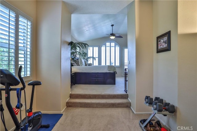 1412 San Clemente Cir, Corona, CA 92882 - workout room with vaulted ceiling, baseboards, a ceiling fan, and carpet flooring