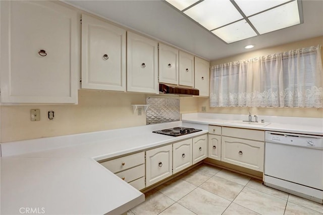 kitchen with a sink, light tile patterned flooring, white dishwasher, black electric stovetop, and light countertops
