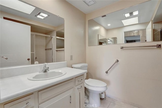 bathroom with visible vents, a shower stall, toilet, tile patterned floors, and vanity