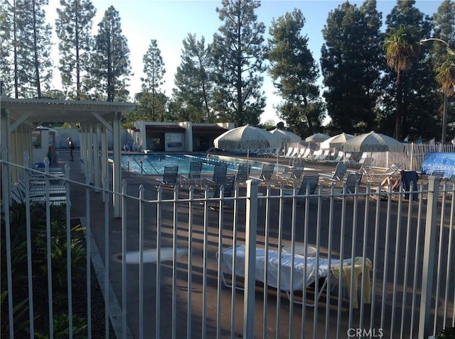 view of gate with fence