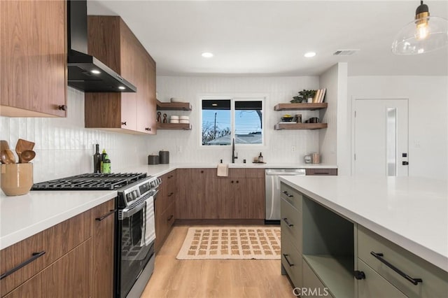 kitchen with visible vents, light wood-style flooring, open shelves, stainless steel appliances, and wall chimney exhaust hood