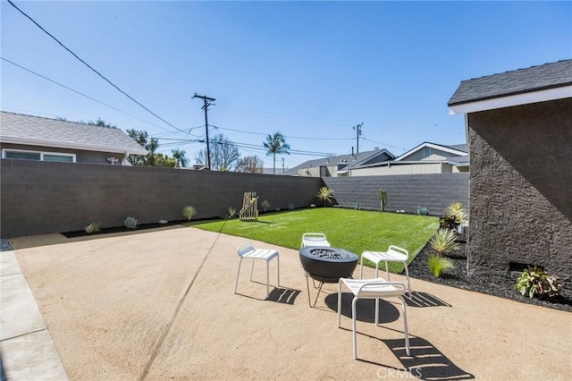 view of patio with an outdoor fire pit and a fenced backyard