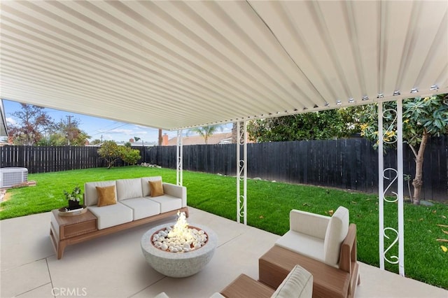 view of patio / terrace with central air condition unit, an outdoor living space with a fire pit, and a fenced backyard