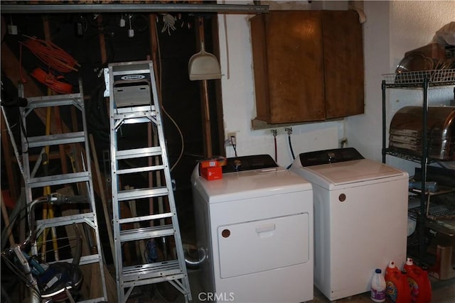 washroom featuring separate washer and dryer and laundry area