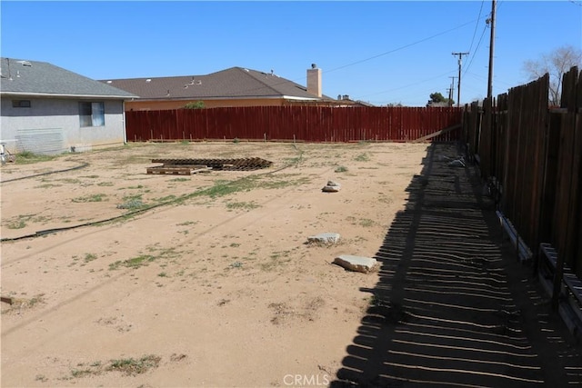 view of yard featuring a fenced backyard