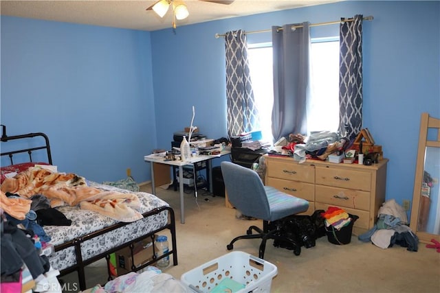 carpeted bedroom with a ceiling fan