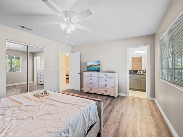 14606 Orange St, Hesperia, CA 92345 - bedroom featuring a closet, a ceiling fan, visible vents, wood finished floors, and baseboards