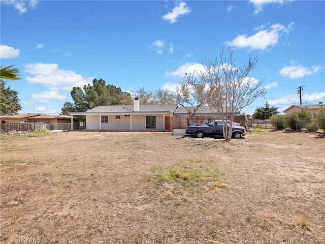 14606 Orange St, Hesperia, CA 92345 - back of property featuring a patio, a chimney, and fence