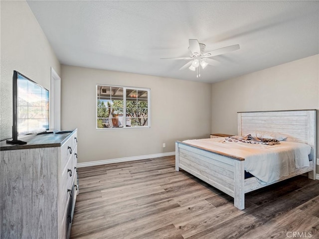 14606 Orange St, Hesperia, CA 92345 - bedroom featuring light wood-style floors, baseboards, and ceiling fan