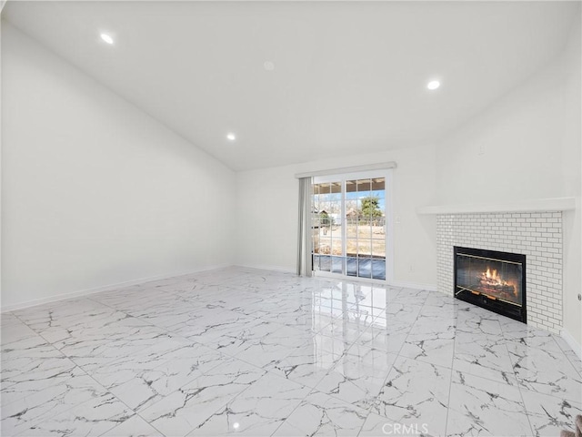 14606 Orange St, Hesperia, CA 92345 - unfurnished living room with marble finish floor, a glass covered fireplace, and recessed lighting