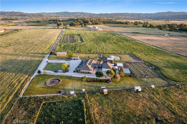 aerial view featuring a mountain view and a rural view