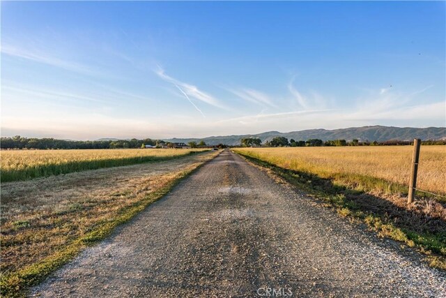 view of street featuring a rural view and a mountain view