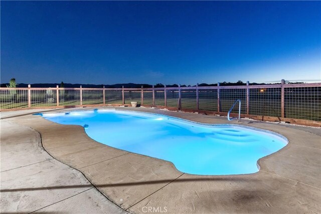 view of swimming pool with a patio area, a fenced backyard, and a fenced in pool