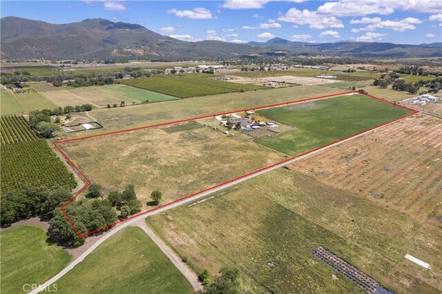 bird's eye view featuring a rural view and a mountain view