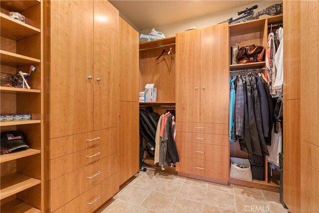 walk in closet featuring tile patterned floors