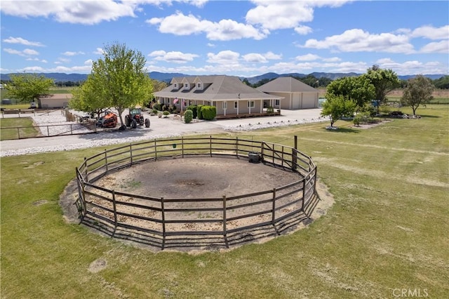 exterior space with a rural view and fence