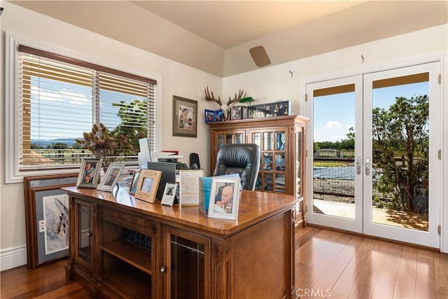 home office featuring wood finished floors and french doors