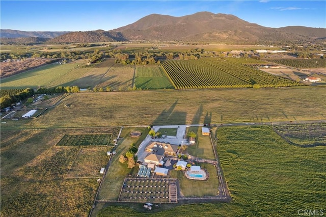 birds eye view of property with a rural view and a mountain view