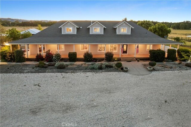 farmhouse featuring covered porch