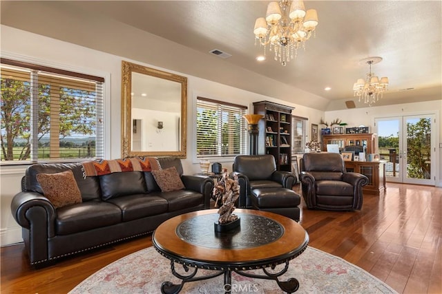 living room featuring an inviting chandelier, hardwood / wood-style flooring, recessed lighting, and visible vents