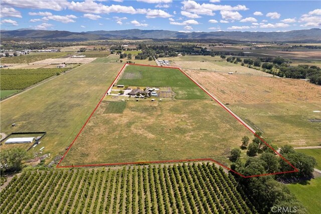 birds eye view of property featuring a rural view and a mountain view