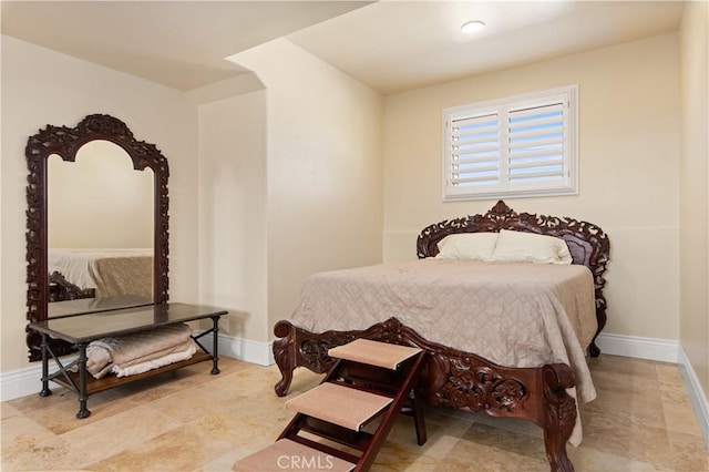 bedroom featuring baseboards