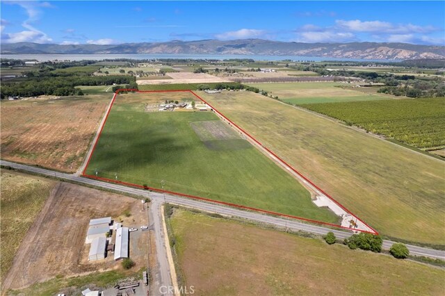 birds eye view of property featuring a rural view and a mountain view