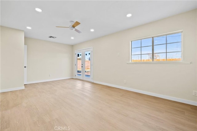 spare room with visible vents, baseboards, recessed lighting, light wood-style floors, and a ceiling fan