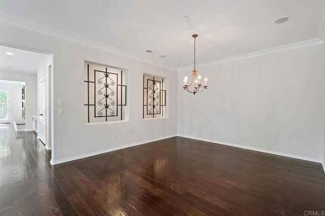 unfurnished room with dark wood finished floors, crown molding, and baseboards