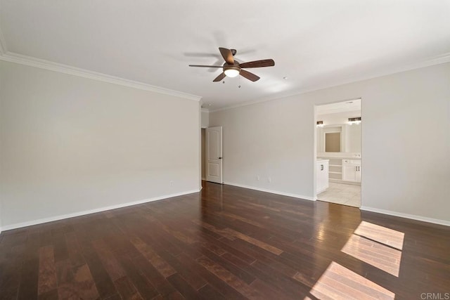 empty room featuring crown molding, wood finished floors, baseboards, and ceiling fan