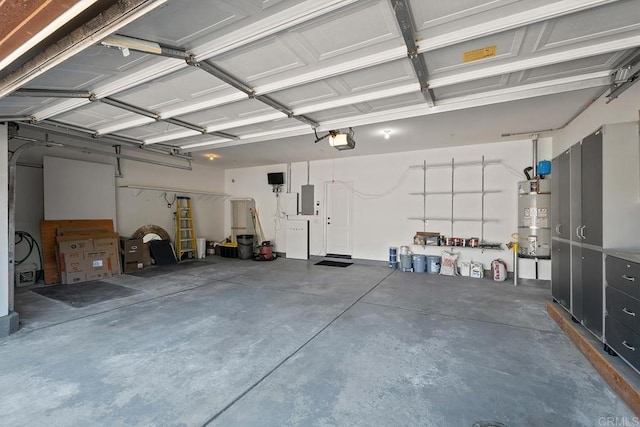 garage featuring electric panel, secured water heater, and a garage door opener