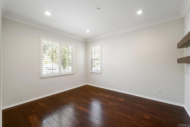 empty room featuring recessed lighting, baseboards, wood-type flooring, and ornamental molding