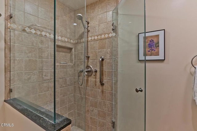 bathroom featuring a stall shower