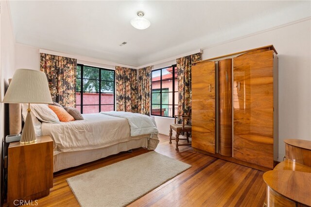 bedroom with wood finished floors