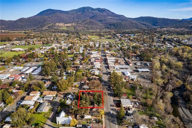 drone / aerial view featuring a mountain view and a residential view