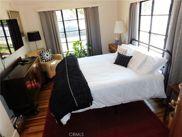 bedroom with wood finished floors