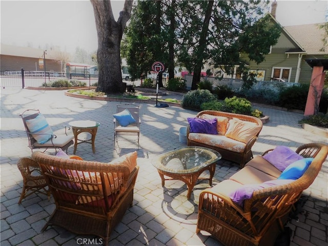 view of patio with outdoor lounge area and fence