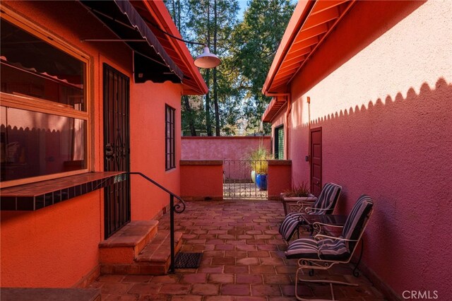 view of patio / terrace featuring fence