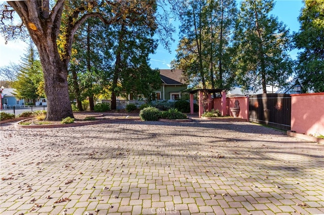 exterior space with a gate and fence