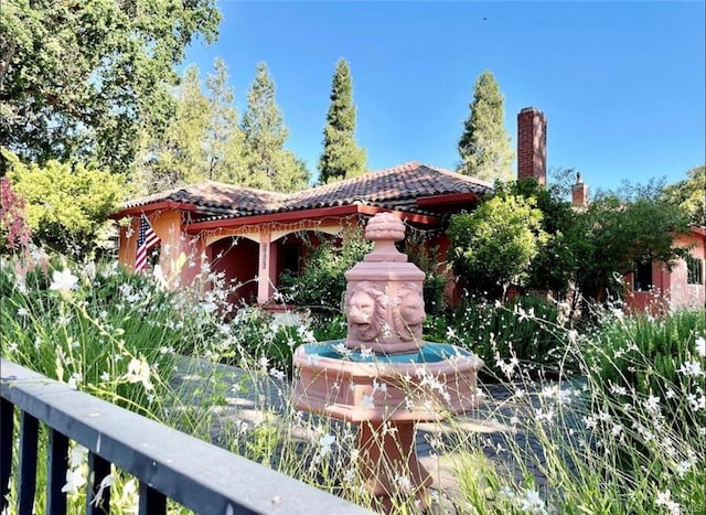 rear view of house with a tiled roof