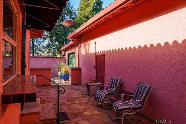 view of patio / terrace featuring fence