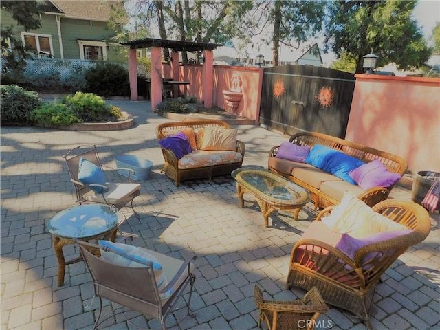 view of patio with a fenced backyard and an outdoor hangout area