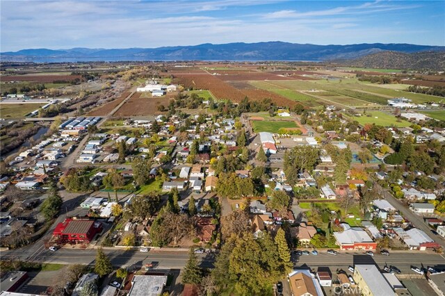 birds eye view of property featuring a mountain view