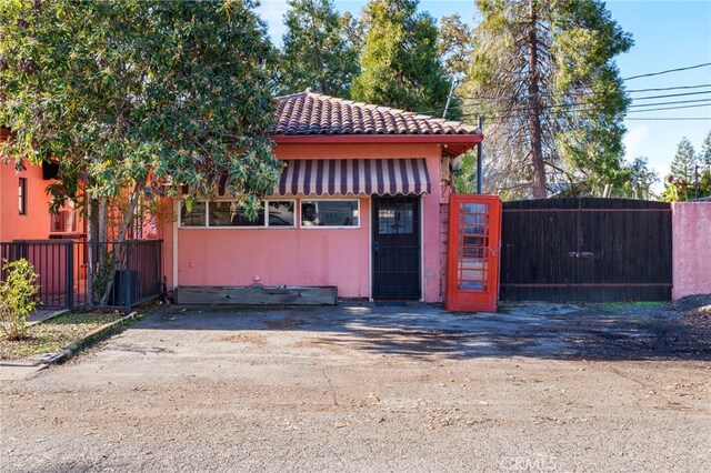 view of outbuilding with fence