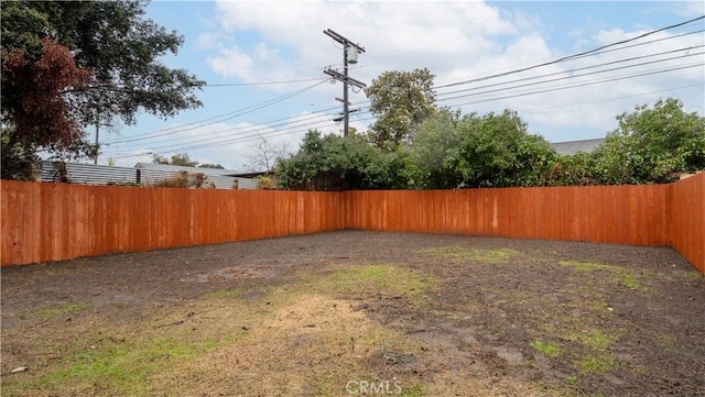 view of yard with a fenced backyard