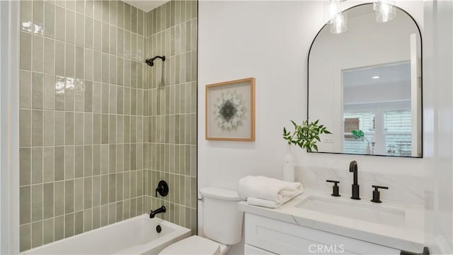 bathroom with toilet, vanity, and shower / tub combination